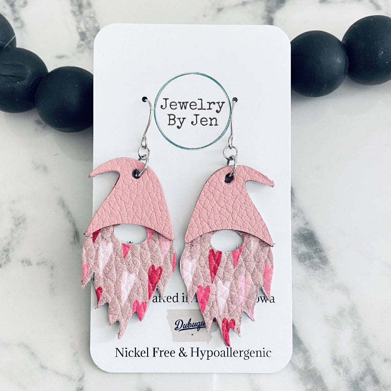 Pink and white gnome earrings with heart patterns, displayed on a card with 'Jewelry by Jen' written on it.